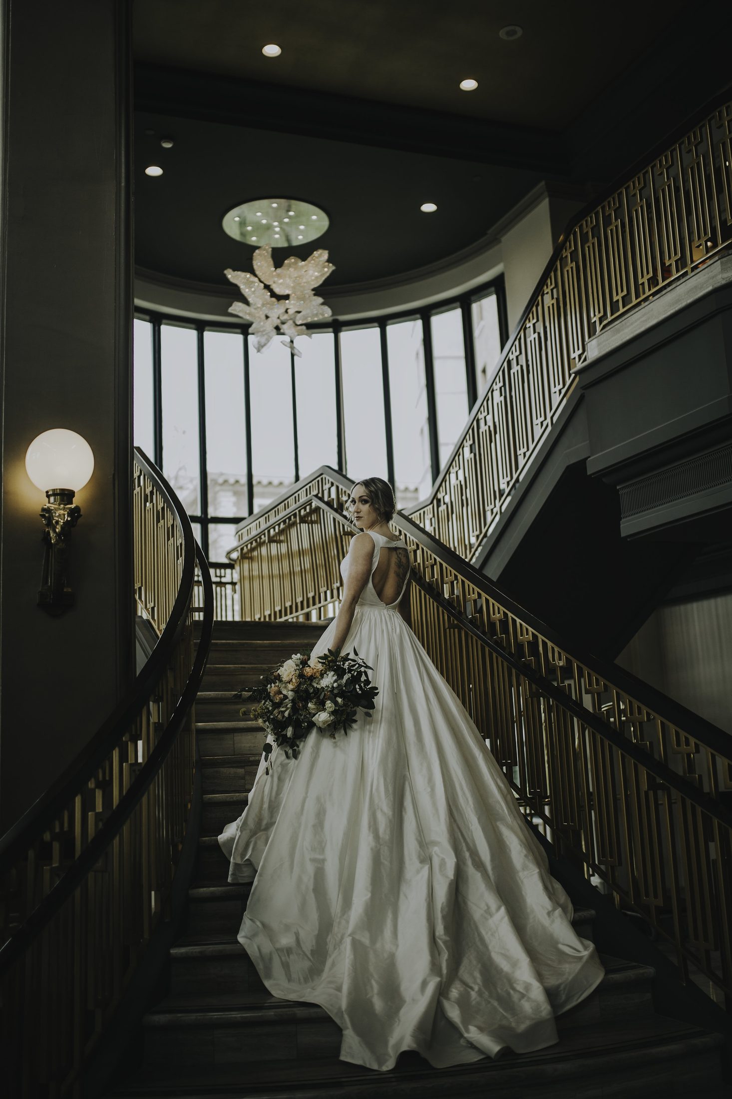 The bride on the Fairmont Empress's grand staircase.
